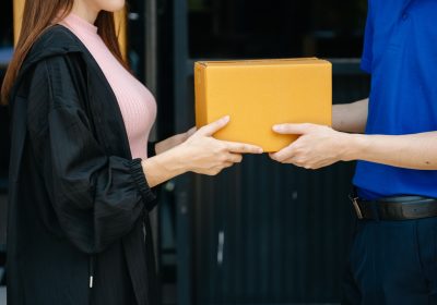 Express Delivery Service. Courier Delivering Package to man Delivery service, delivery home Express Delivery Service. Courier Delivering Package to man Delivery service, delivery home