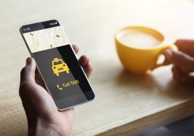 Unrecognizable Man Ordering Taxi Calling By Smartphone Indoors, Cropped, Closeup Unrecognizable Man Ordering Taxi Calling By Smartphone Indoors, Cropped, Closeup